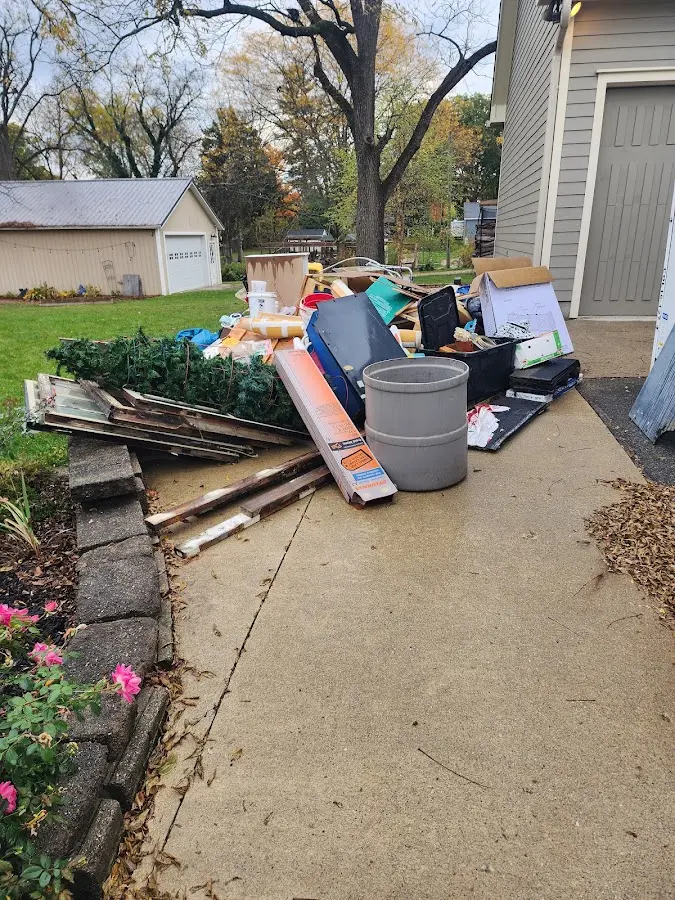 Dumpster being loaded with debris for Residential Dumpster Rental in Middle River
